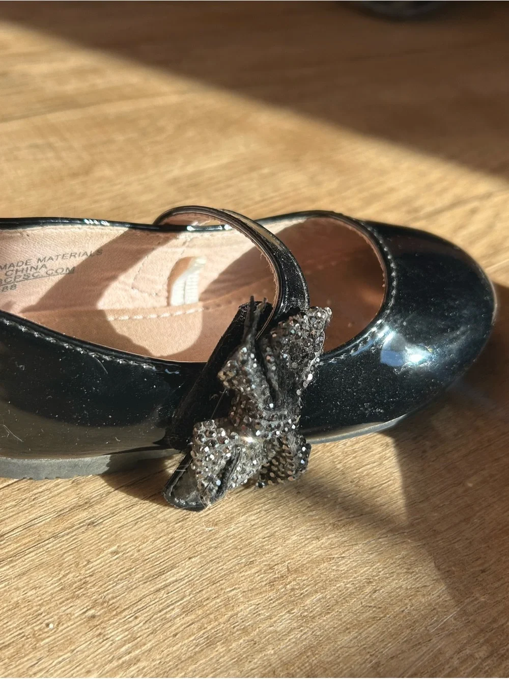 cupcakes & cashmere Black Patent Mary Jane Flats with Decorative Flower